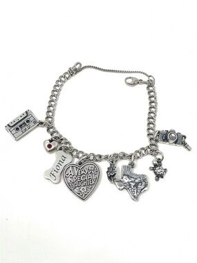 JAMES AVERY sterling silver charm bracelet, 8 charms